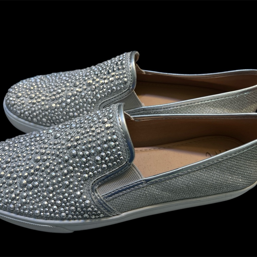 New without tags; size 9M women’s silver slip on shoes
